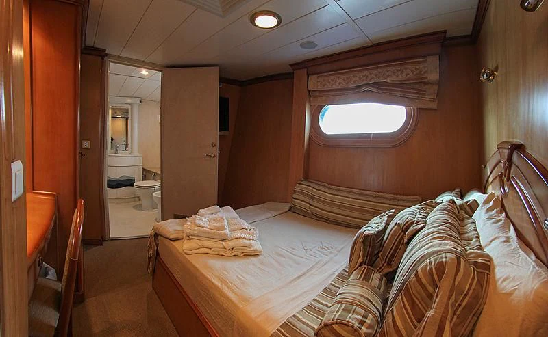a hotel room with a bed aboard PRINCESS OF PALAU Yacht for Sale