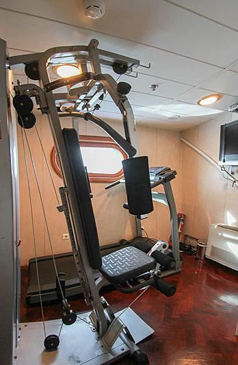 a gym with exercise equipment aboard PRINCESS OF PALAU Yacht for Sale