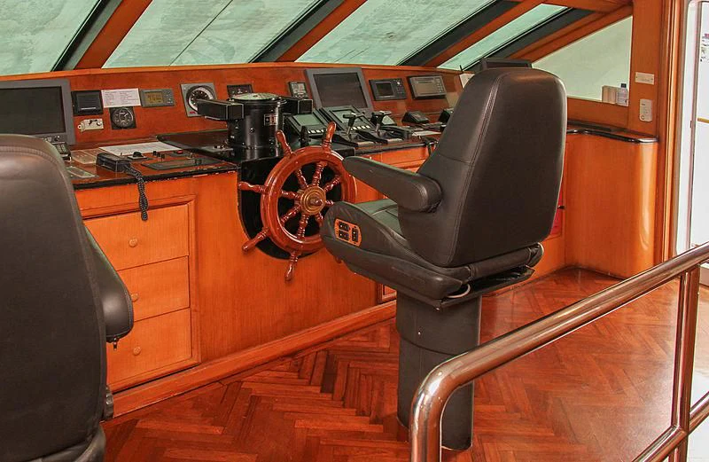 a black leather chair in a room aboard PRINCESS OF PALAU Yacht for Sale