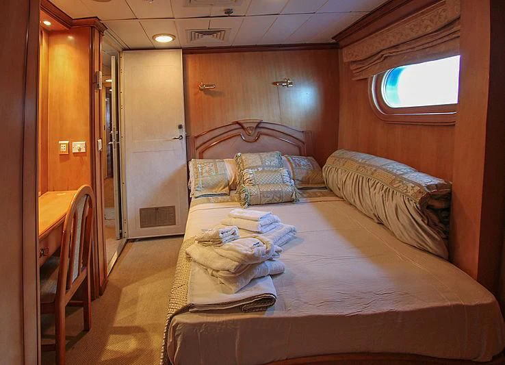 a room with two beds aboard PRINCESS OF PALAU Yacht for Sale