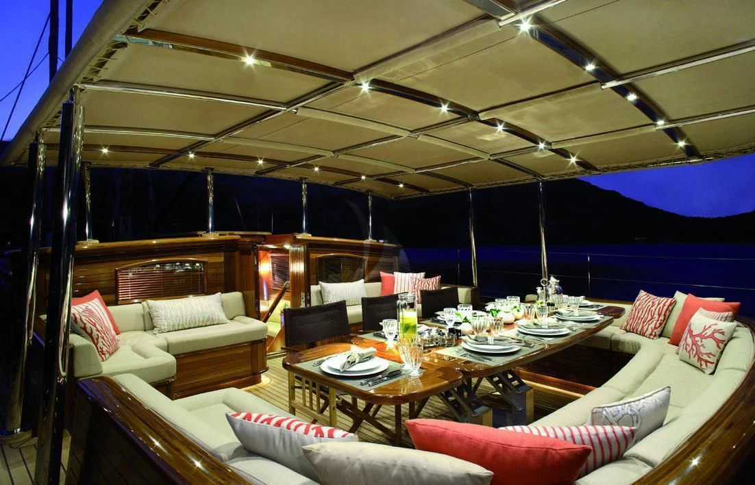a room with a bed and a table aboard EUGENIA VII Yacht for Sale