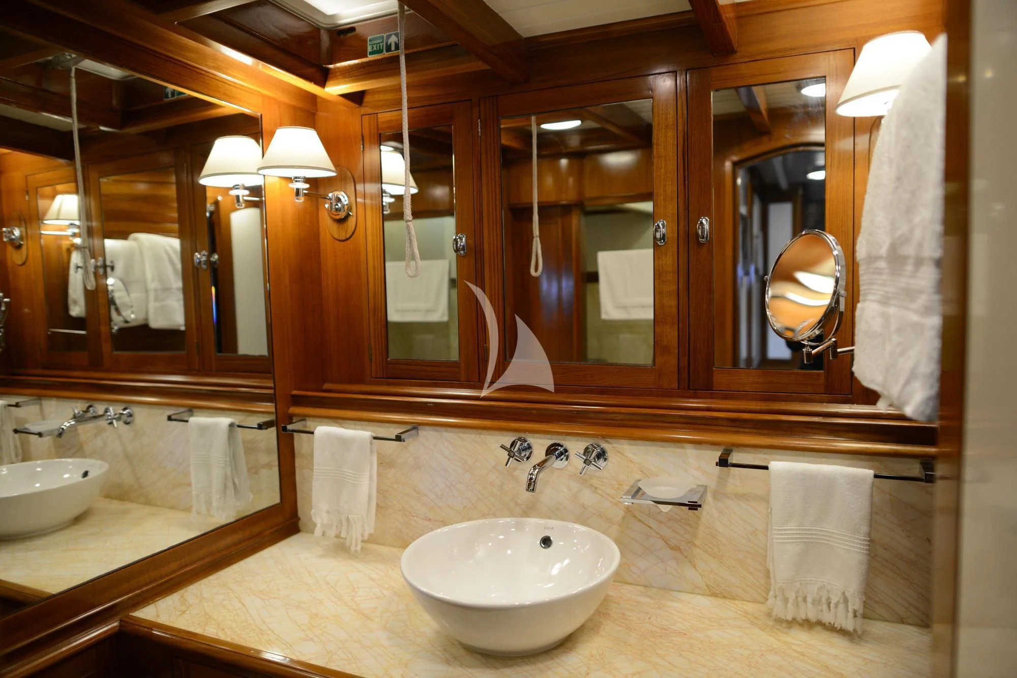 a bathroom with a large mirror aboard EUGENIA VII Yacht for Sale