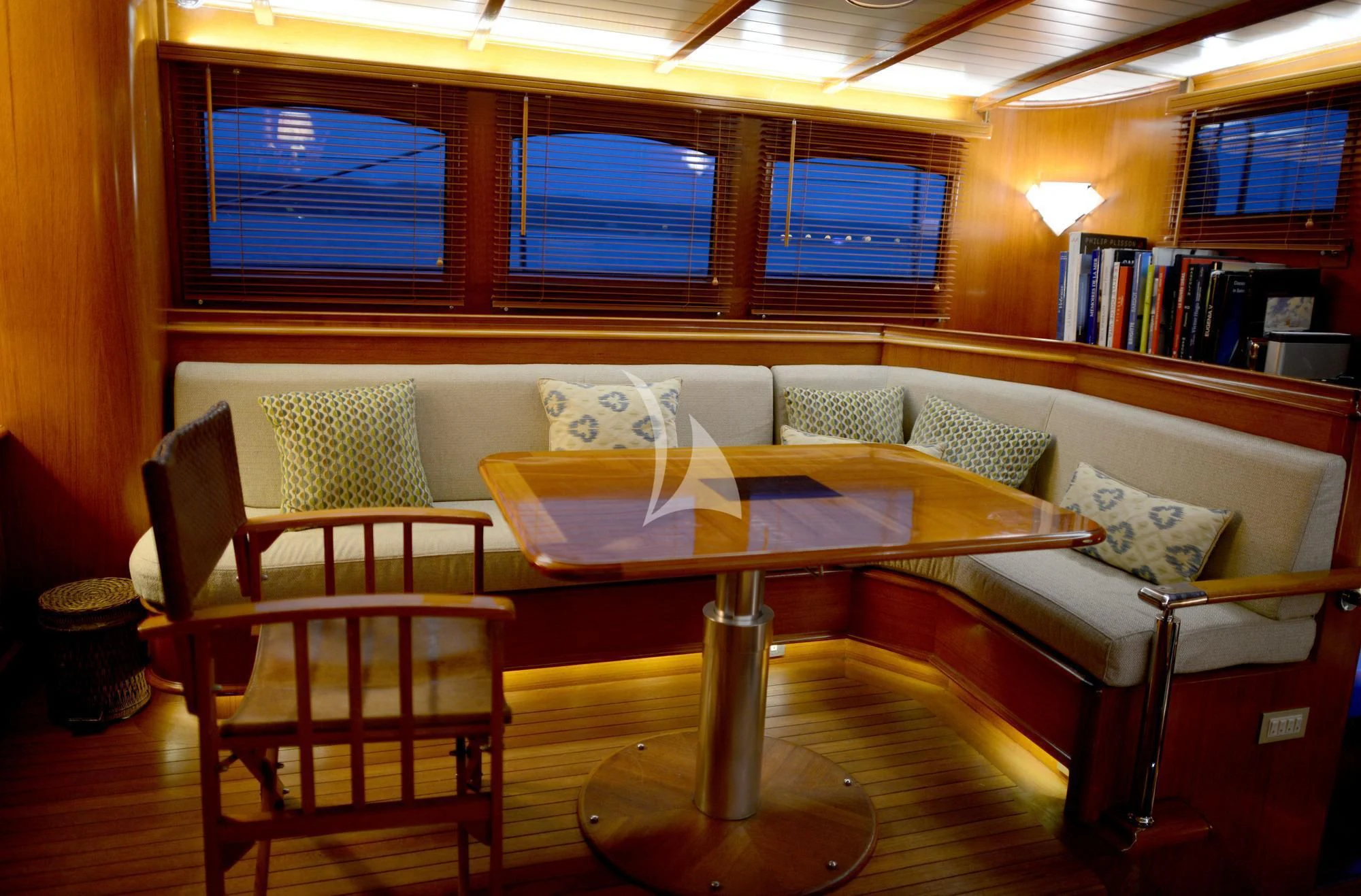 a living room with a couch and a table aboard EUGENIA VII Yacht for Sale