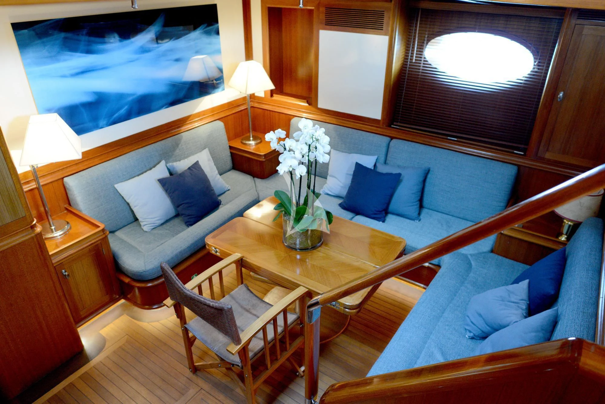 a living room with a couch and a table aboard EUGENIA VII Yacht for Sale