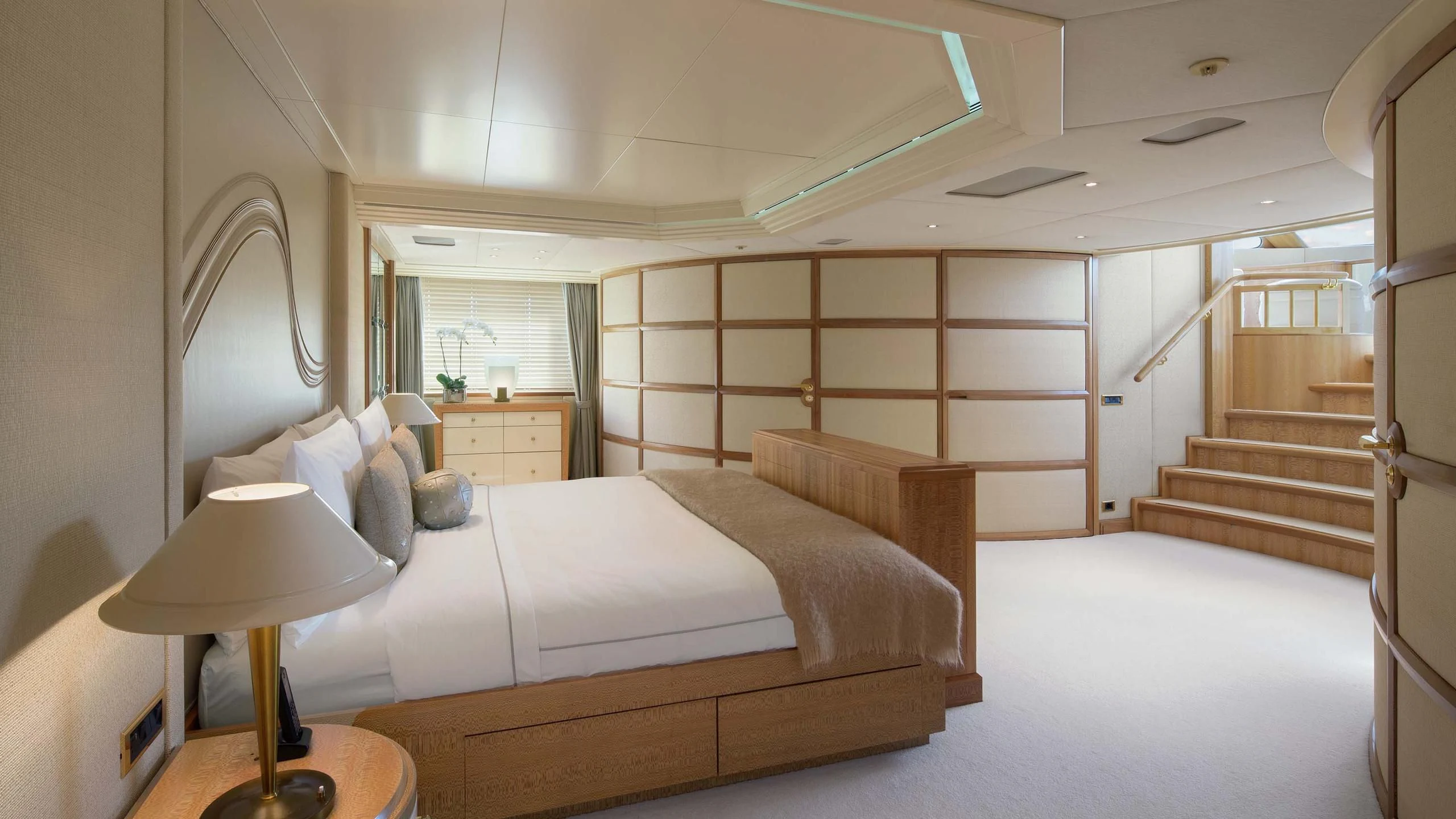 a room with a bed and a staircase aboard AO Yacht for Sale