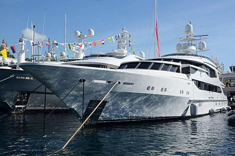 a large white boat with a couple of white boats on it aboard AO Yacht for Sale