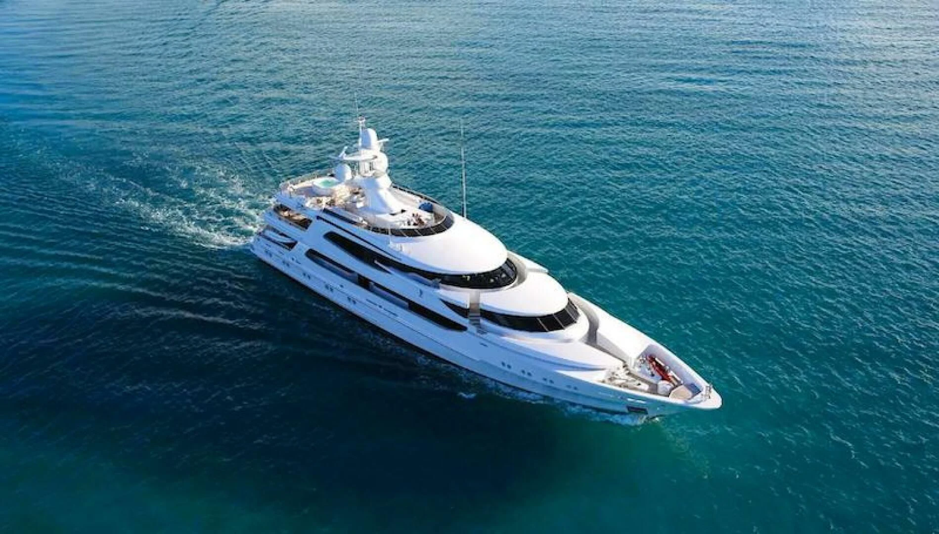 a white boat in the water aboard AO Yacht for Sale