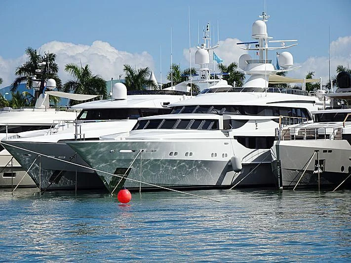 a couple of boats in a harbor aboard AO Yacht for Sale