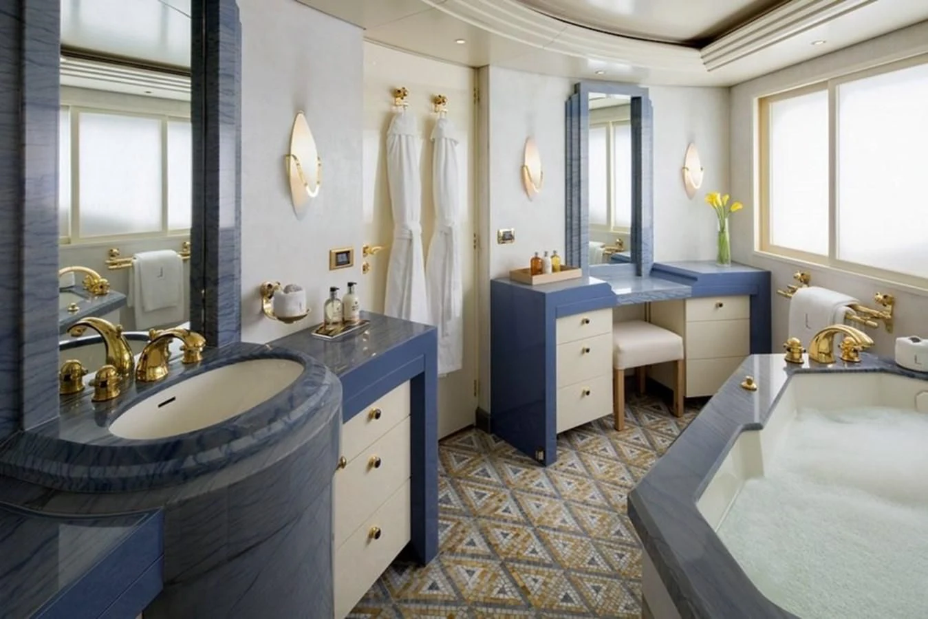 a bathroom with a sink and a bathtub aboard AO Yacht for Sale