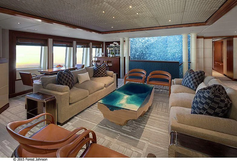 a living room with a large window aboard AO Yacht for Sale
