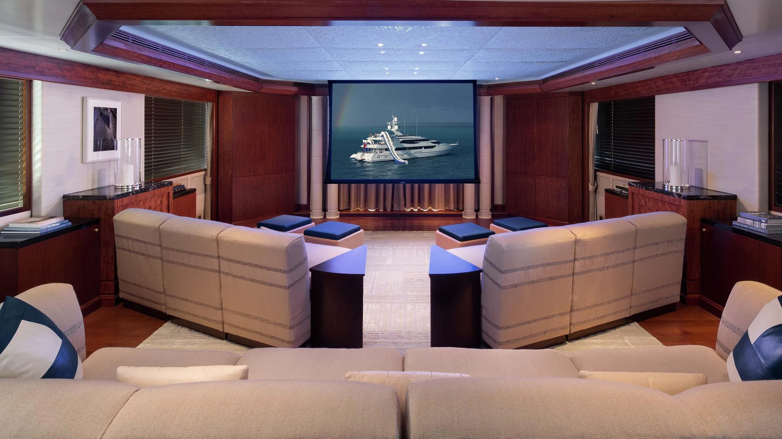 a room with couches and a tv aboard AO Yacht for Sale