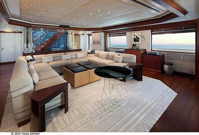 a living room with a large open window aboard AO Yacht for Sale