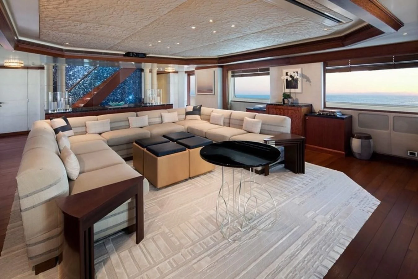 a living room with a large window aboard AO Yacht for Sale