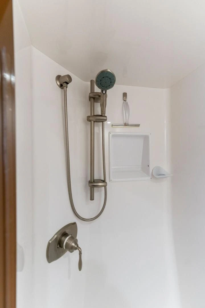 a pair of silver ear buds from a white wall aboard THE PROVIDER Yacht for Sale