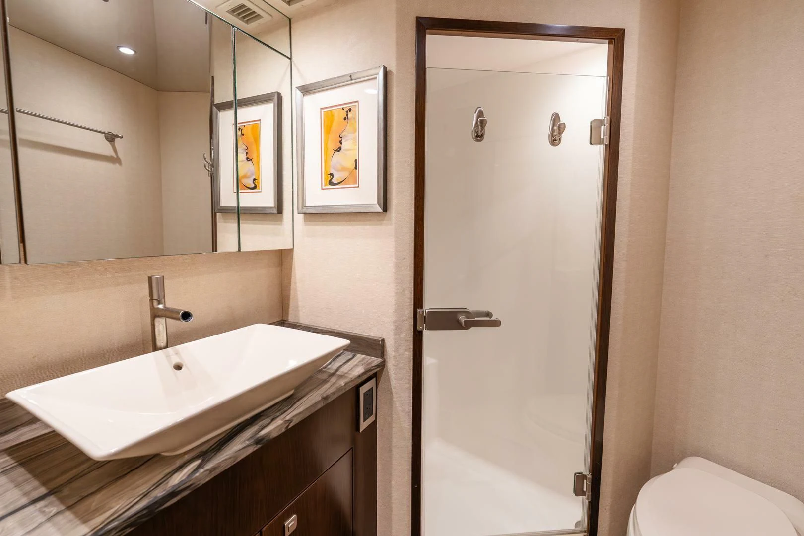 a bathroom with a sink and a mirror aboard THE PROVIDER Yacht for Sale