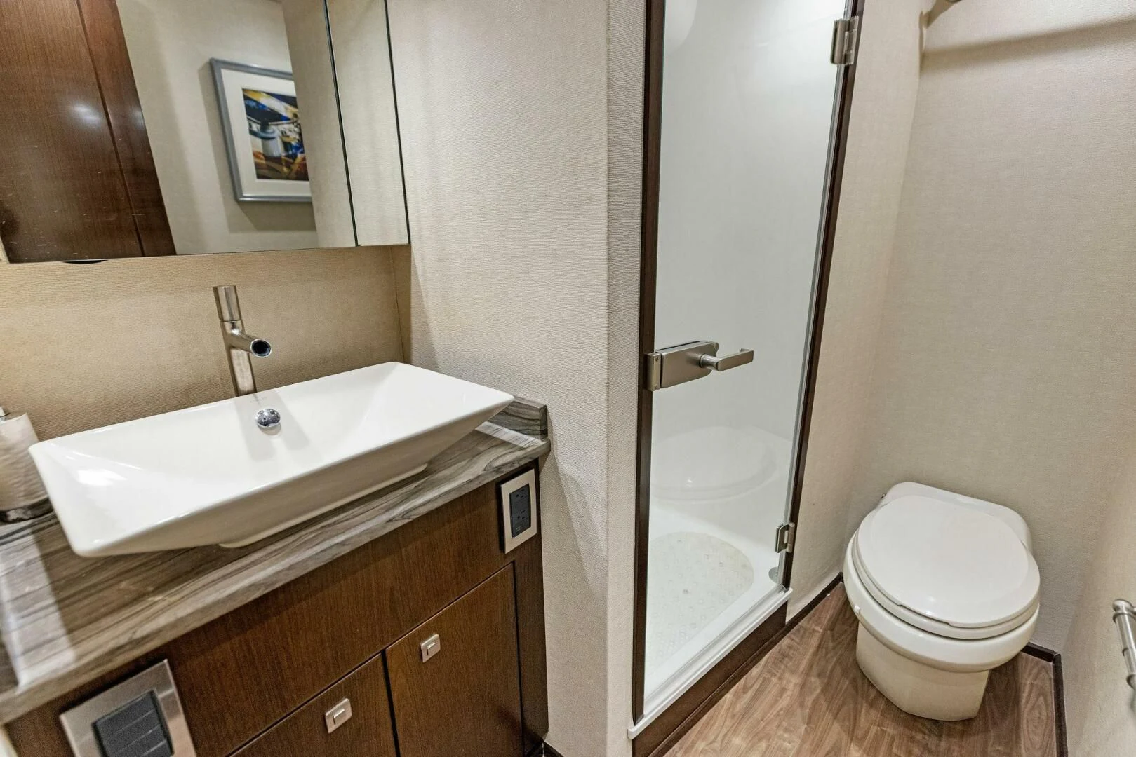 a bathroom with a toilet and a sink aboard THE PROVIDER Yacht for Sale