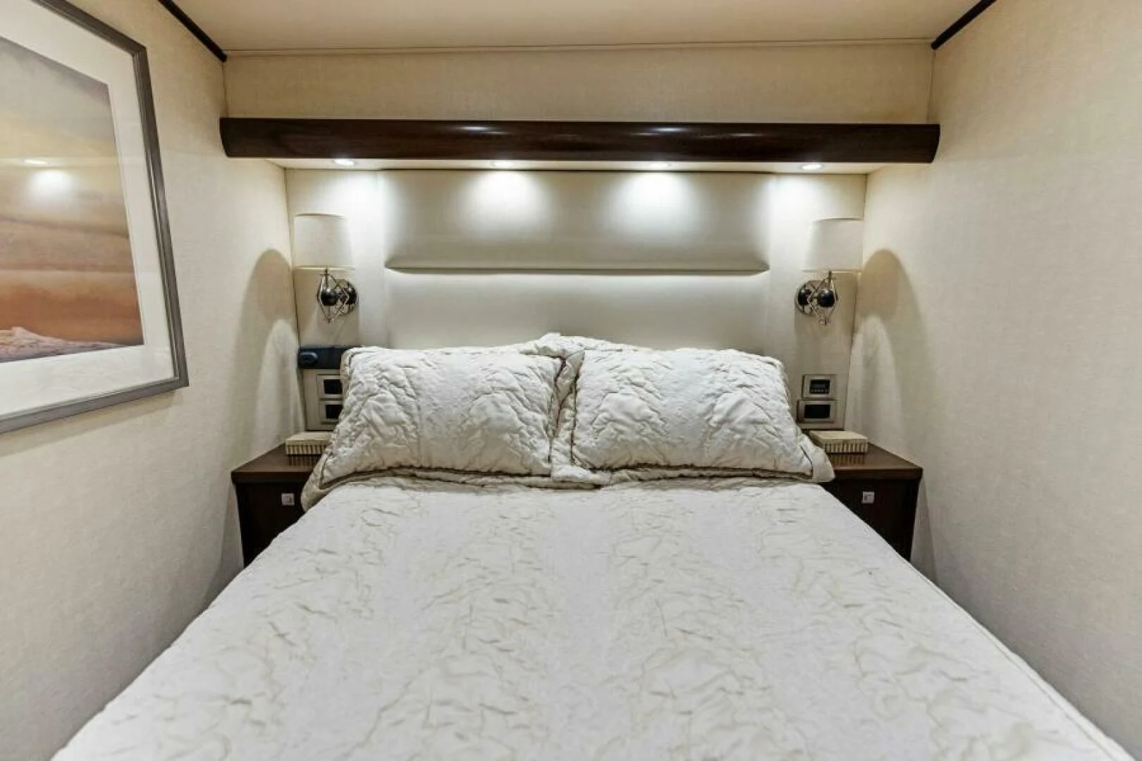a bed with white sheets aboard THE PROVIDER Yacht for Sale