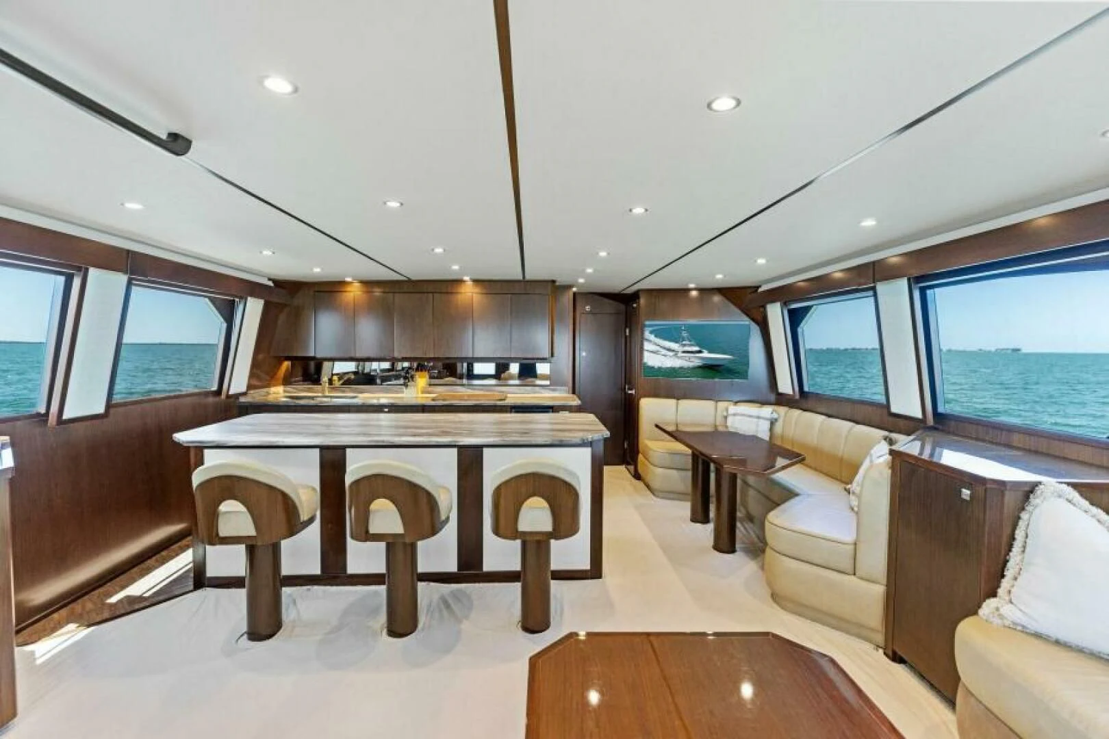 a large living room with a large table and chairs aboard THE PROVIDER Yacht for Sale