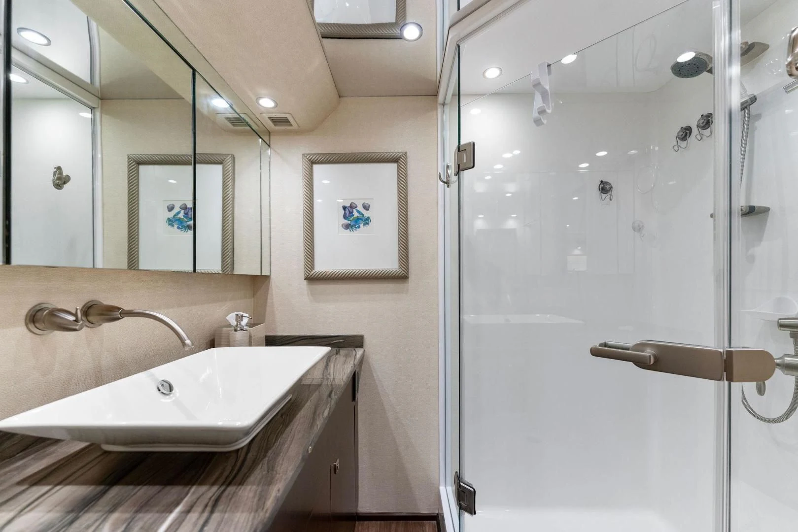 a bathroom with a large mirror aboard THE PROVIDER Yacht for Sale