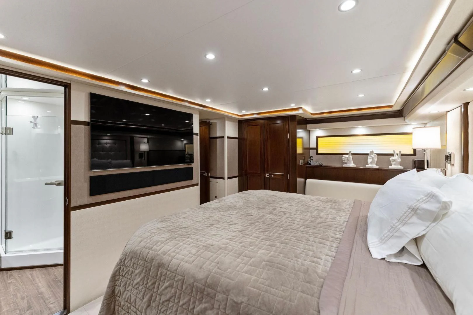 a bedroom with a bed and a television aboard THE PROVIDER Yacht for Sale