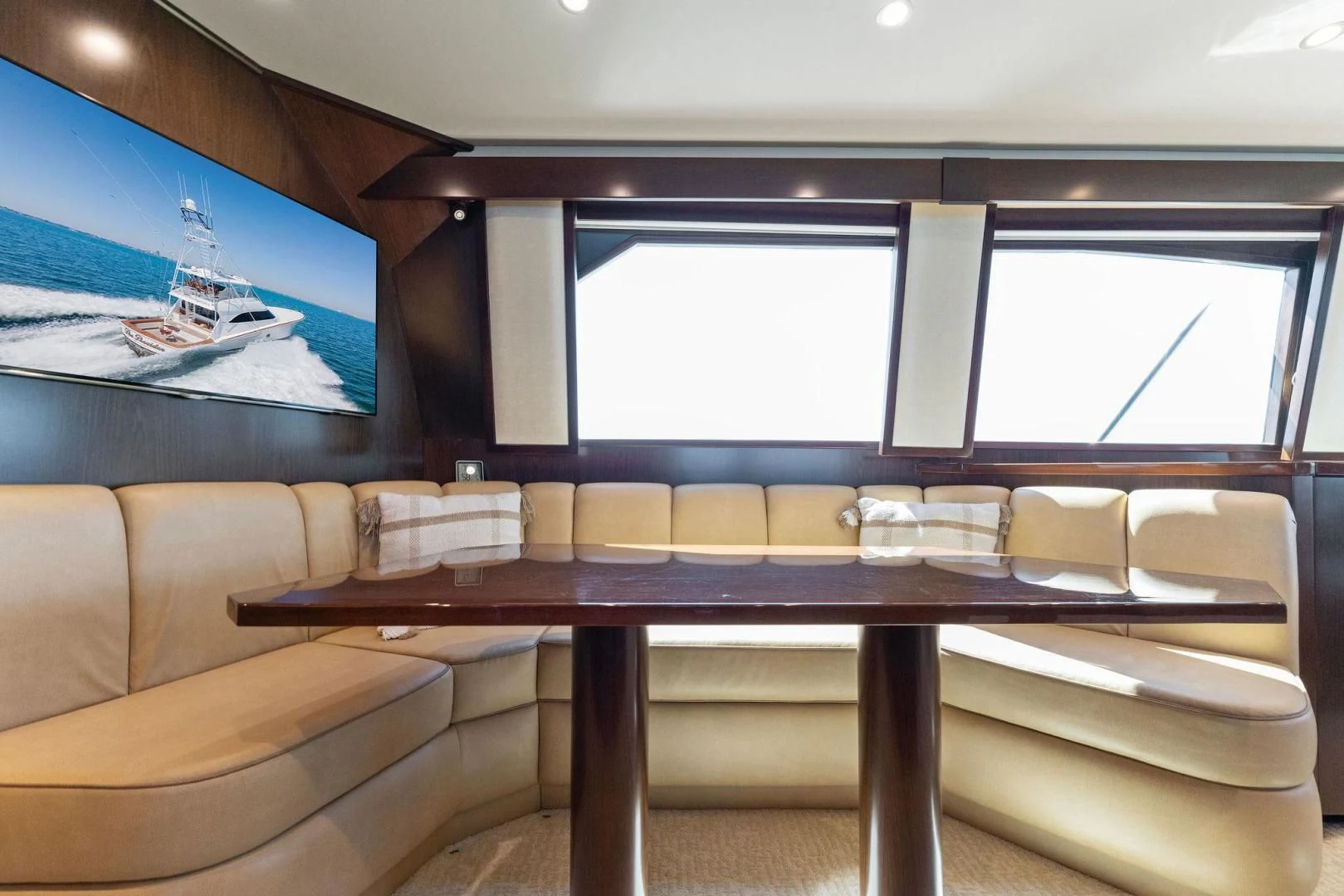 a room with a table and couches aboard THE PROVIDER Yacht for Sale