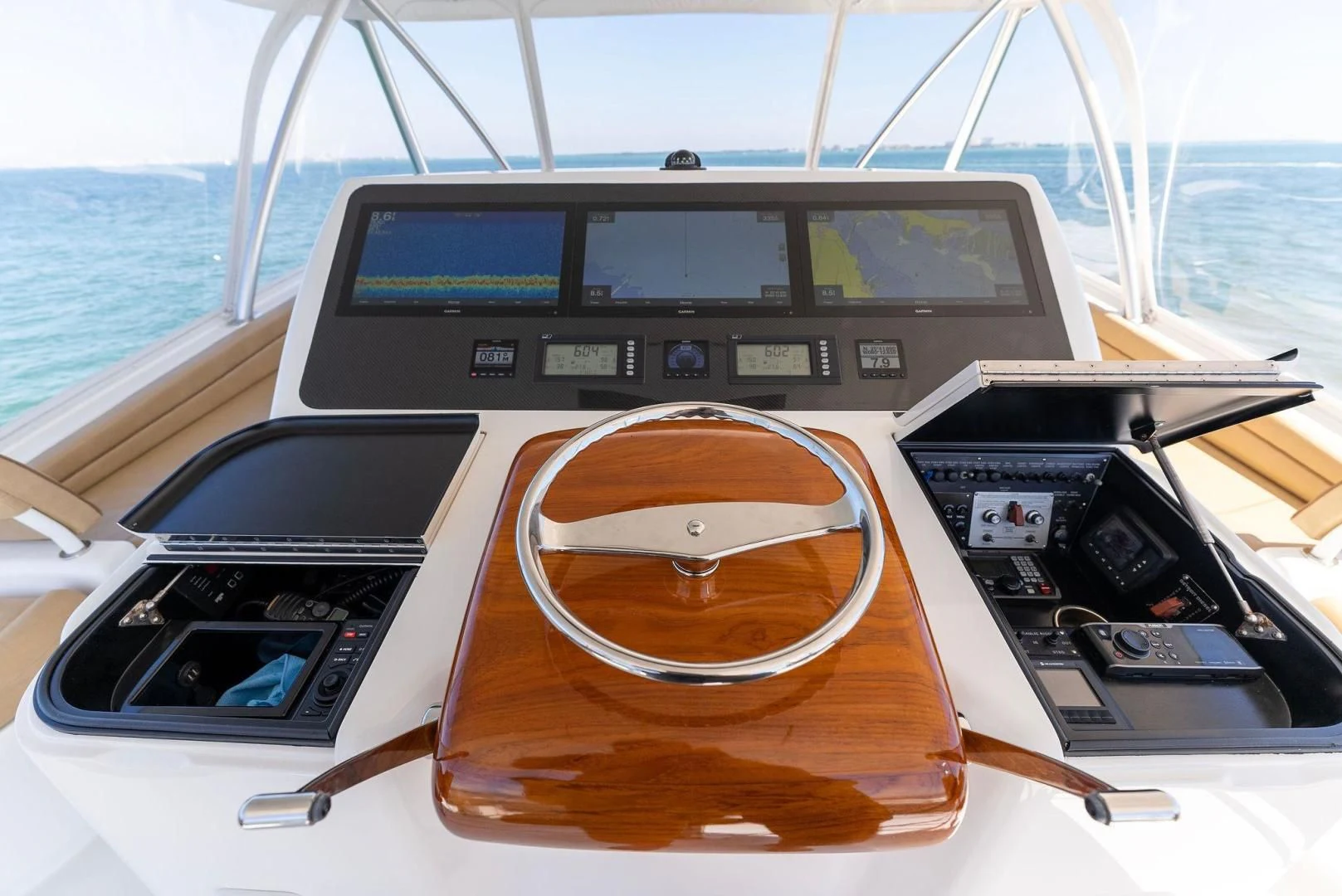 a boat with a steering wheel and a couple of laptops on it aboard THE PROVIDER Yacht for Sale