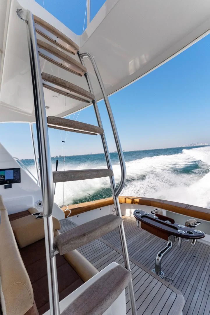 a boat with a view of the beach and water aboard THE PROVIDER Yacht for Sale