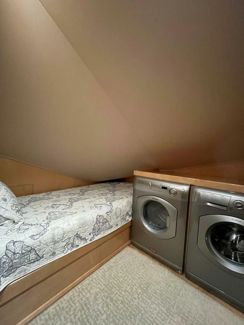 a small bedroom with a bed aboard THE PROVIDER Yacht for Sale