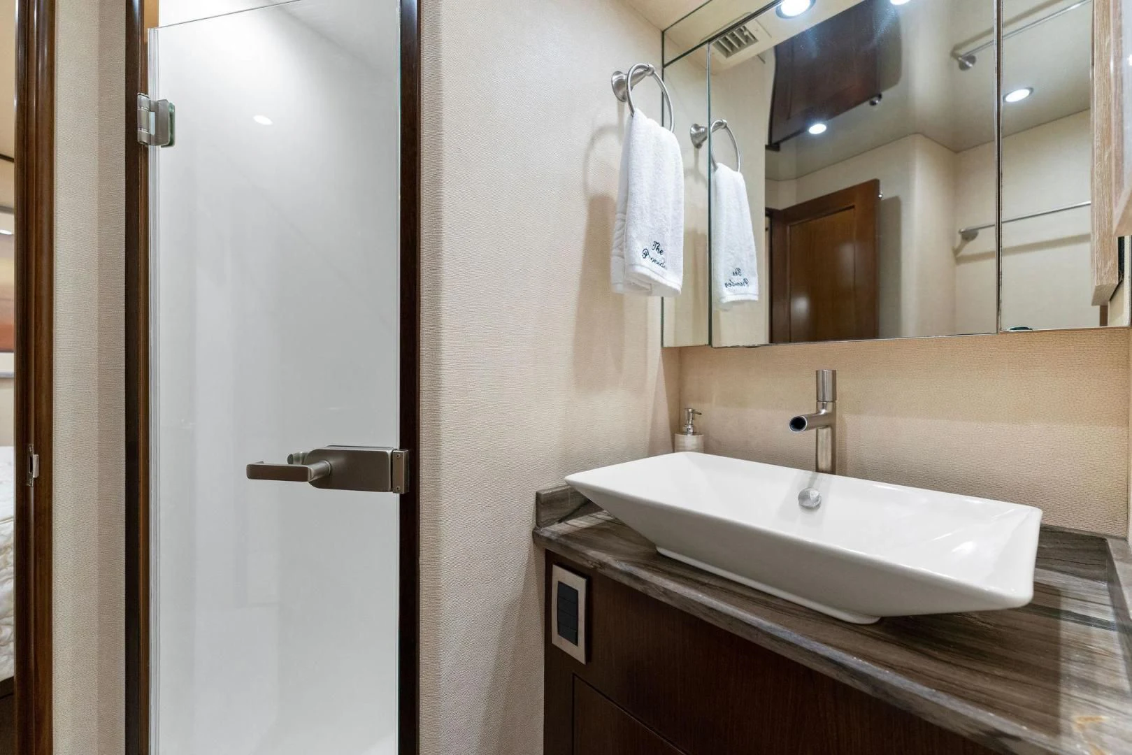 a bathroom with a sink and mirror aboard THE PROVIDER Yacht for Sale