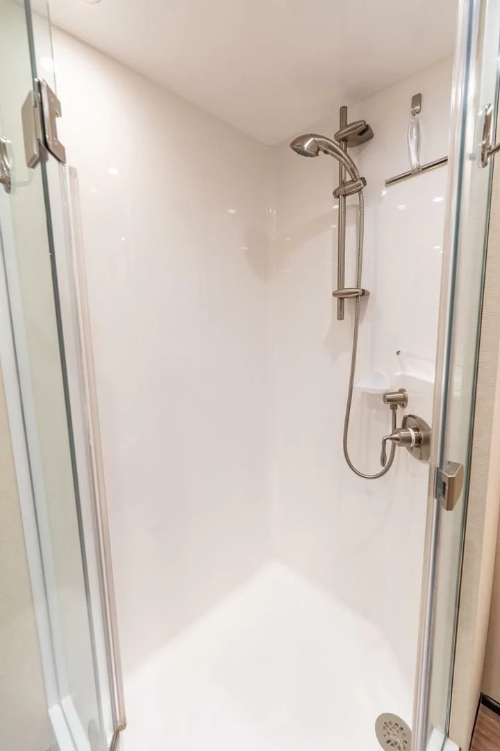 a shower with a white wall aboard THE PROVIDER Yacht for Sale