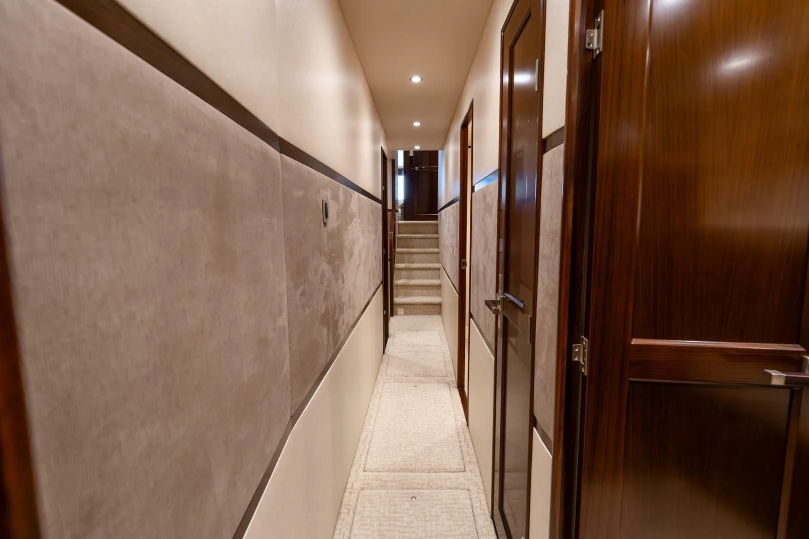 a long hallway with doors aboard THE PROVIDER Yacht for Sale