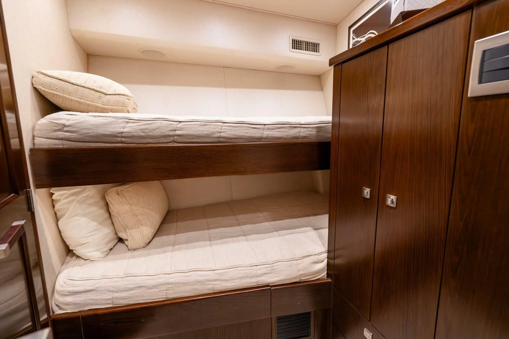 a bed with a wooden headboard aboard THE PROVIDER Yacht for Sale