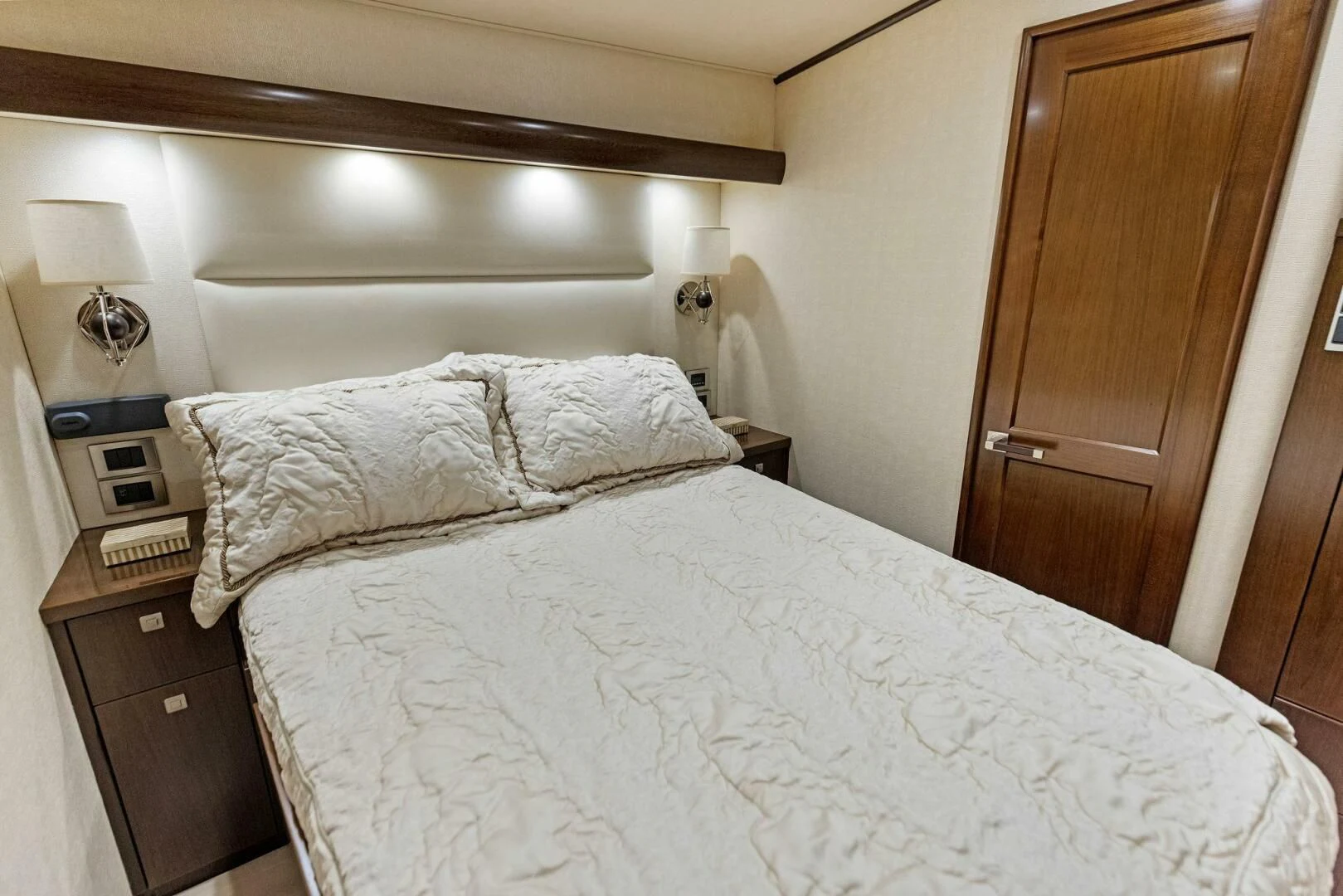 a bed with white sheets aboard THE PROVIDER Yacht for Sale
