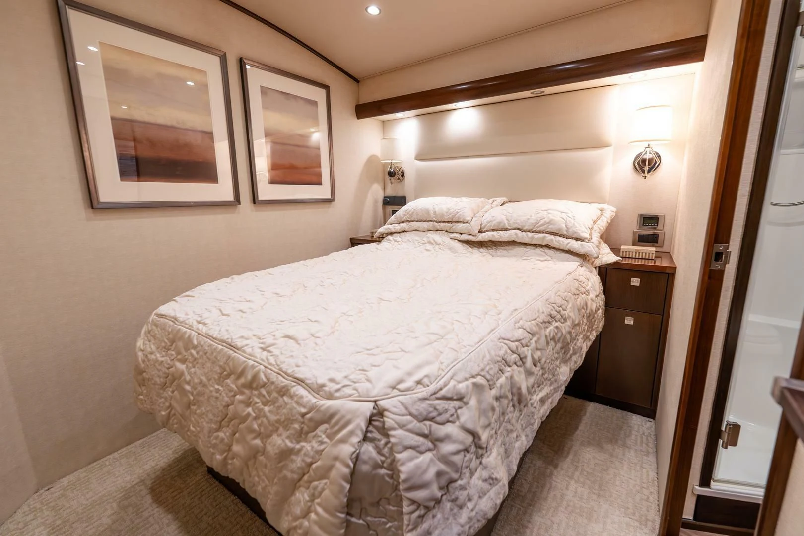 a bedroom with a bed and a mirror aboard THE PROVIDER Yacht for Sale