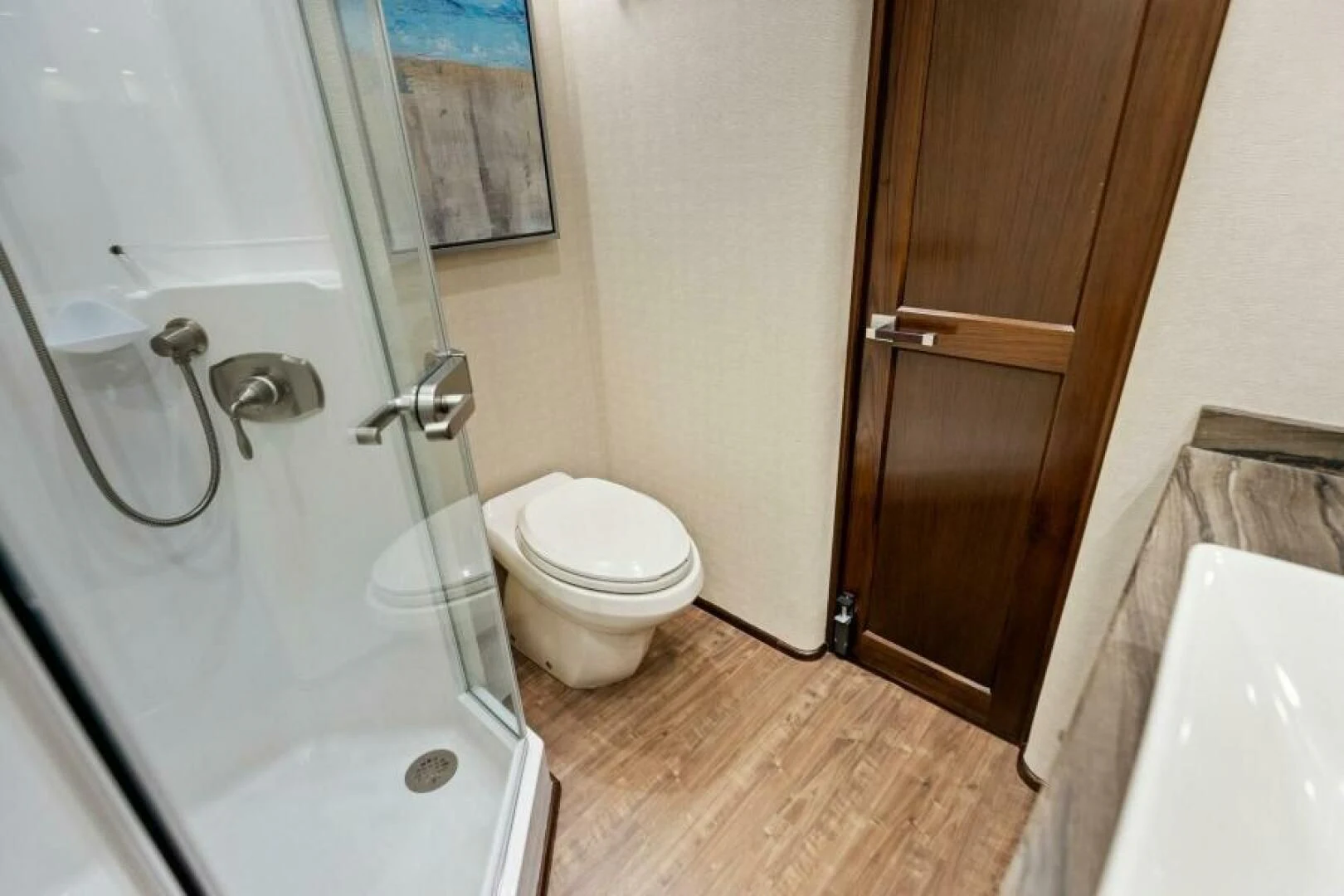 a bathroom with a toilet and a sink aboard THE PROVIDER Yacht for Sale