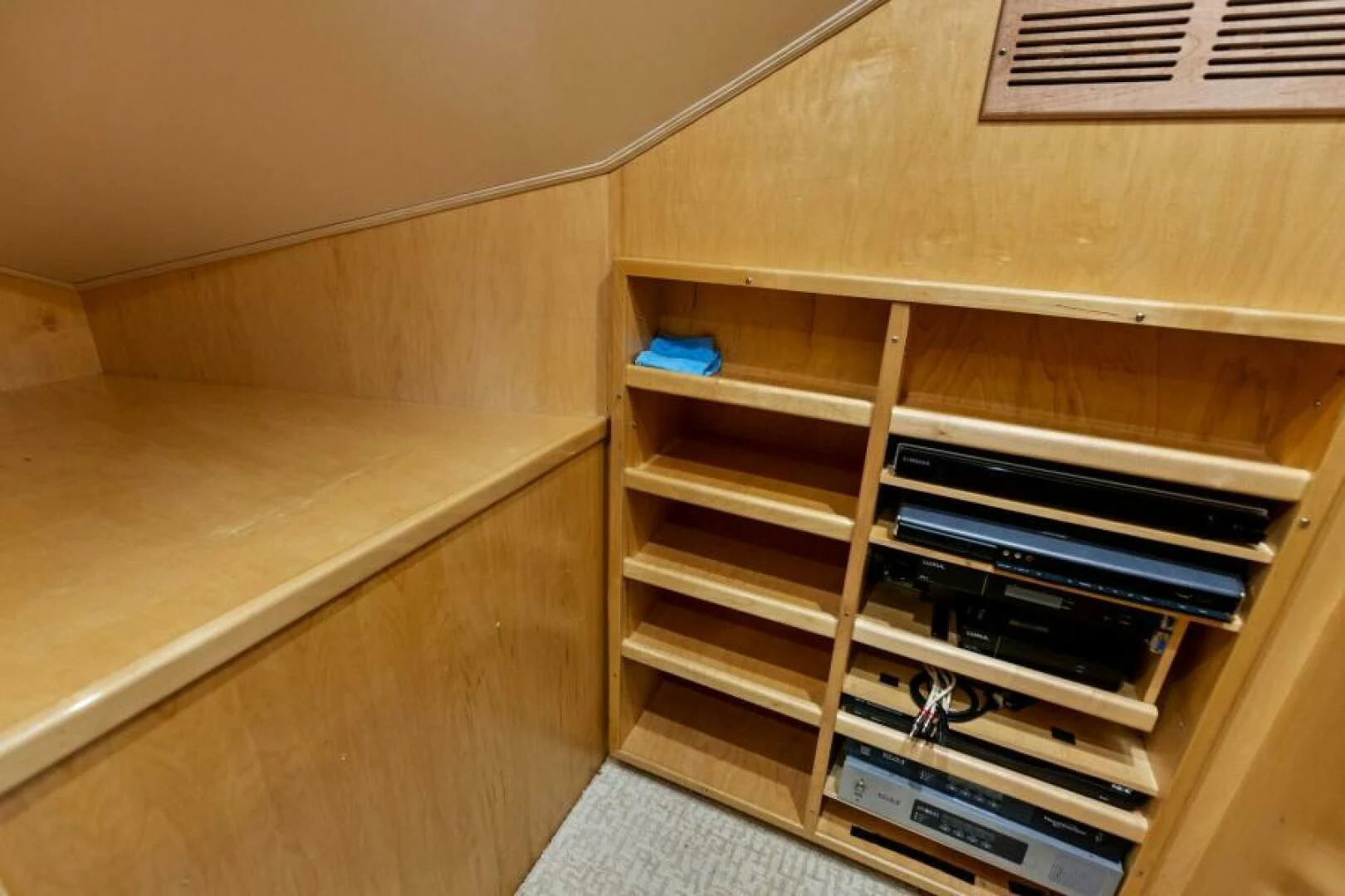 a wooden shelf with books on it aboard THE PROVIDER Yacht for Sale