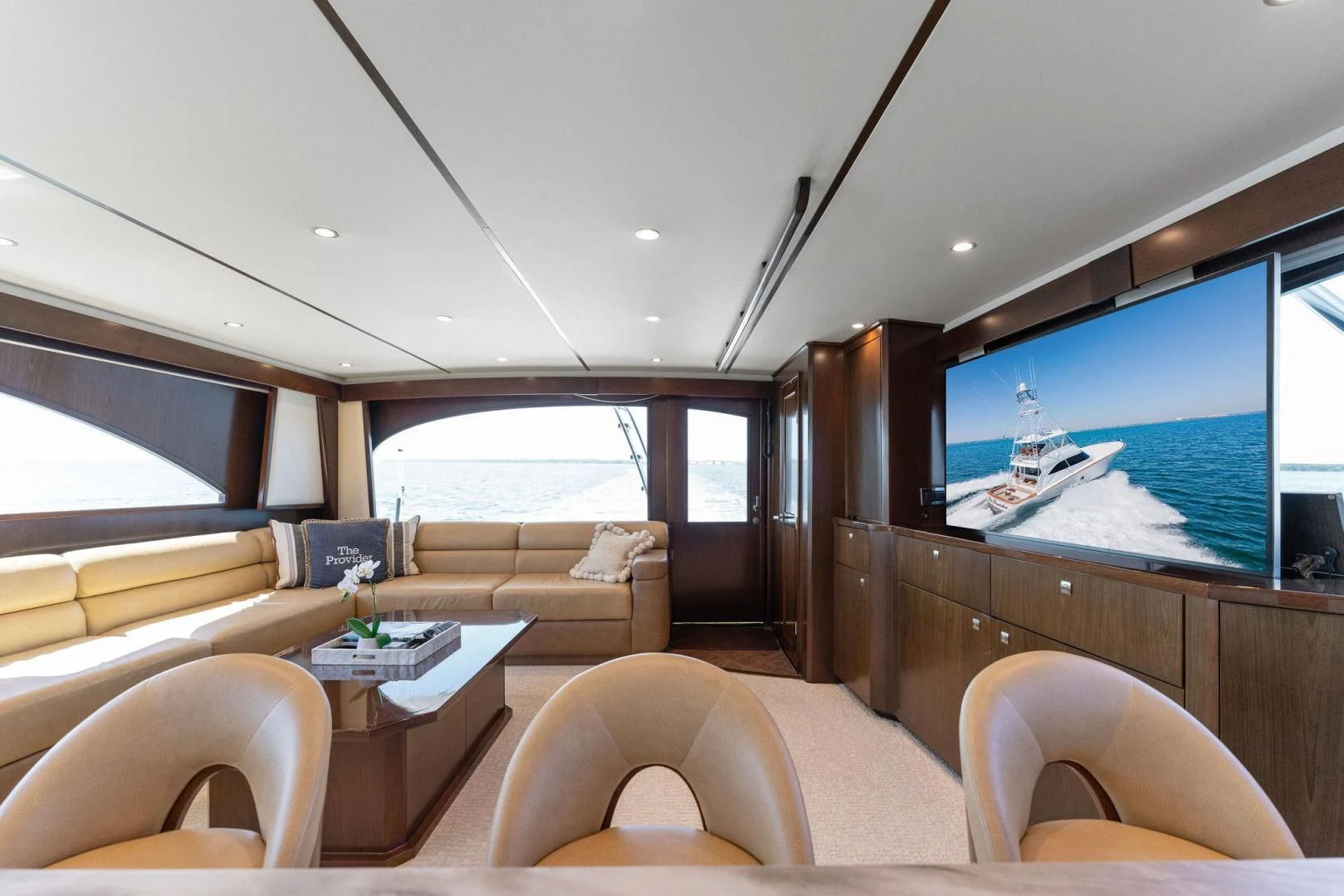 a living room with a large screen aboard THE PROVIDER Yacht for Sale