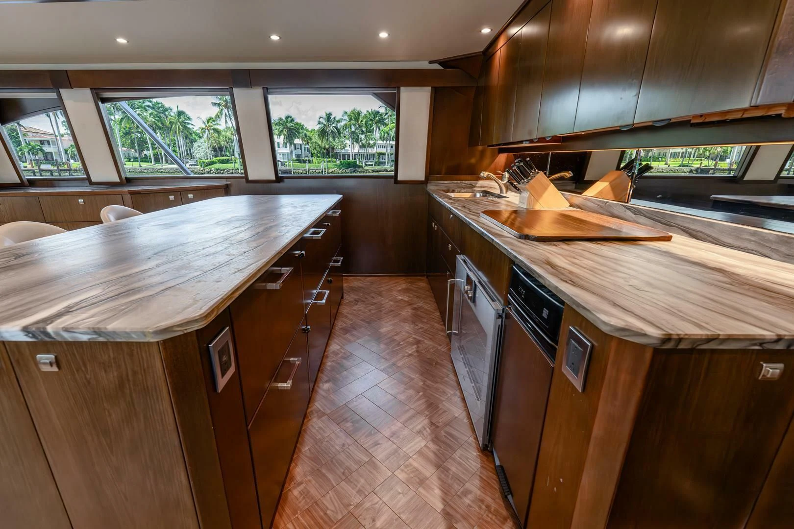 a kitchen with wooden cabinets aboard THE PROVIDER Yacht for Sale