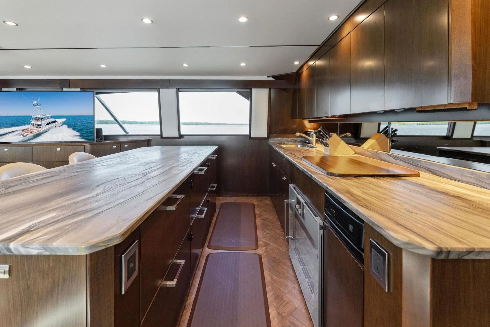 a kitchen with wooden cabinets aboard THE PROVIDER Yacht for Sale