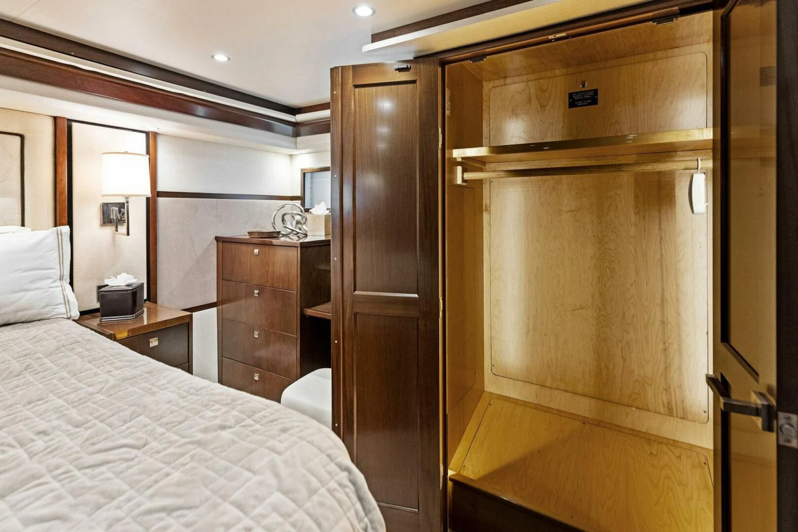 a bedroom with a bed and a closet aboard THE PROVIDER Yacht for Sale