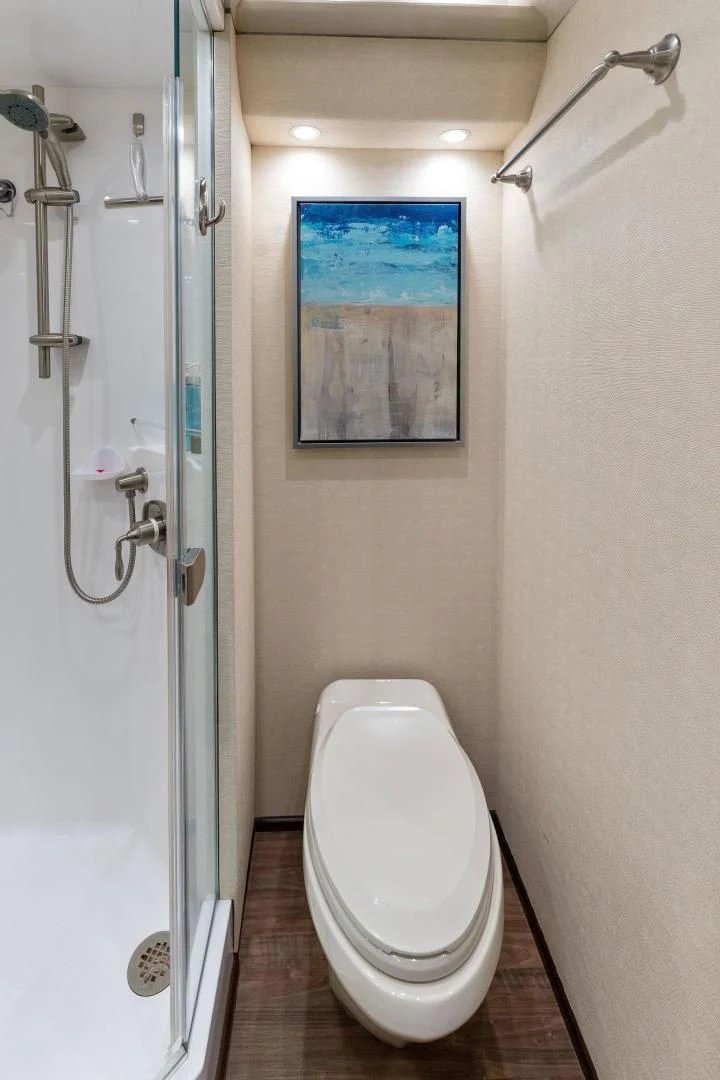 a bathroom with a toilet and a shower aboard THE PROVIDER Yacht for Sale