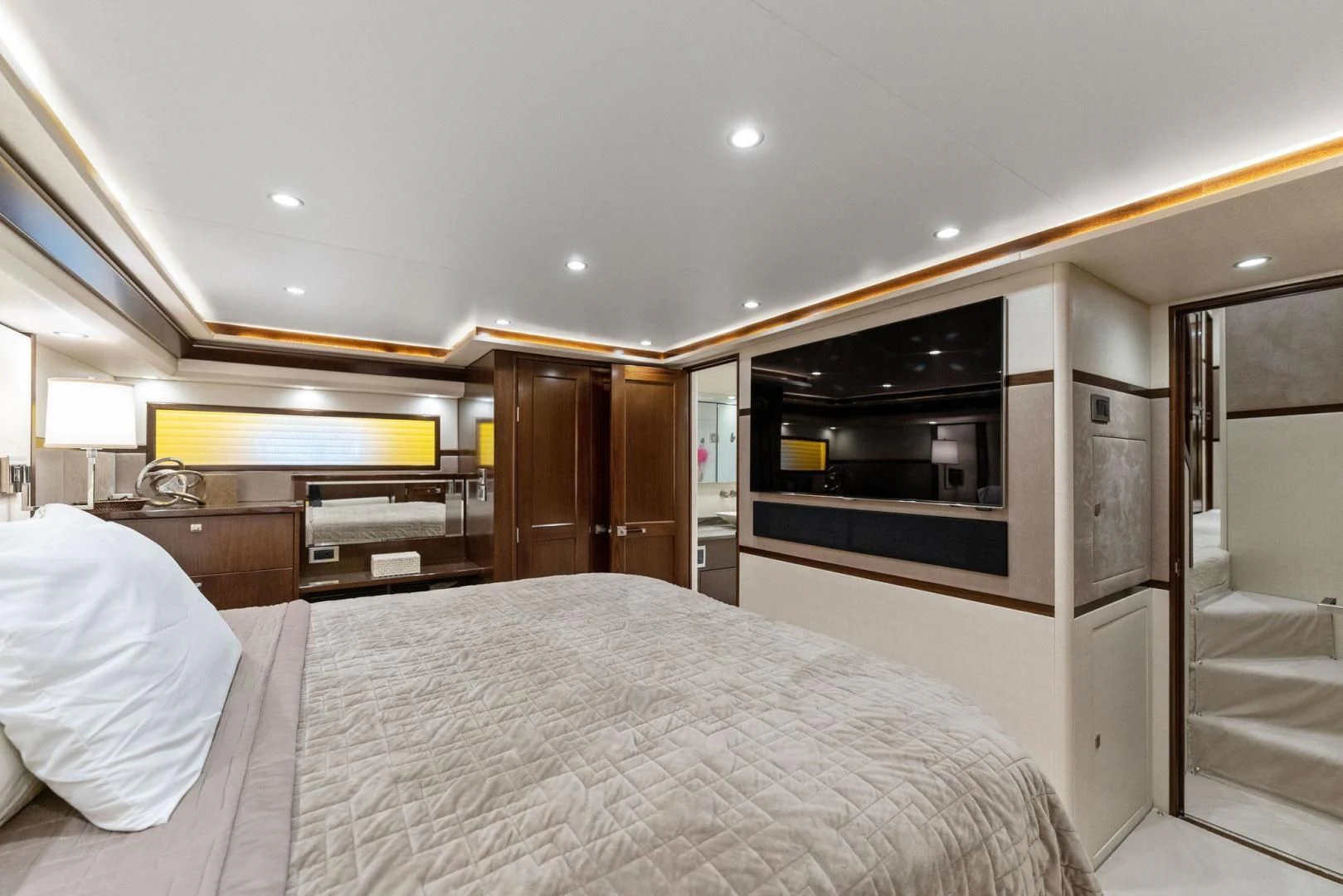 a bedroom with a bed and a tv aboard THE PROVIDER Yacht for Sale