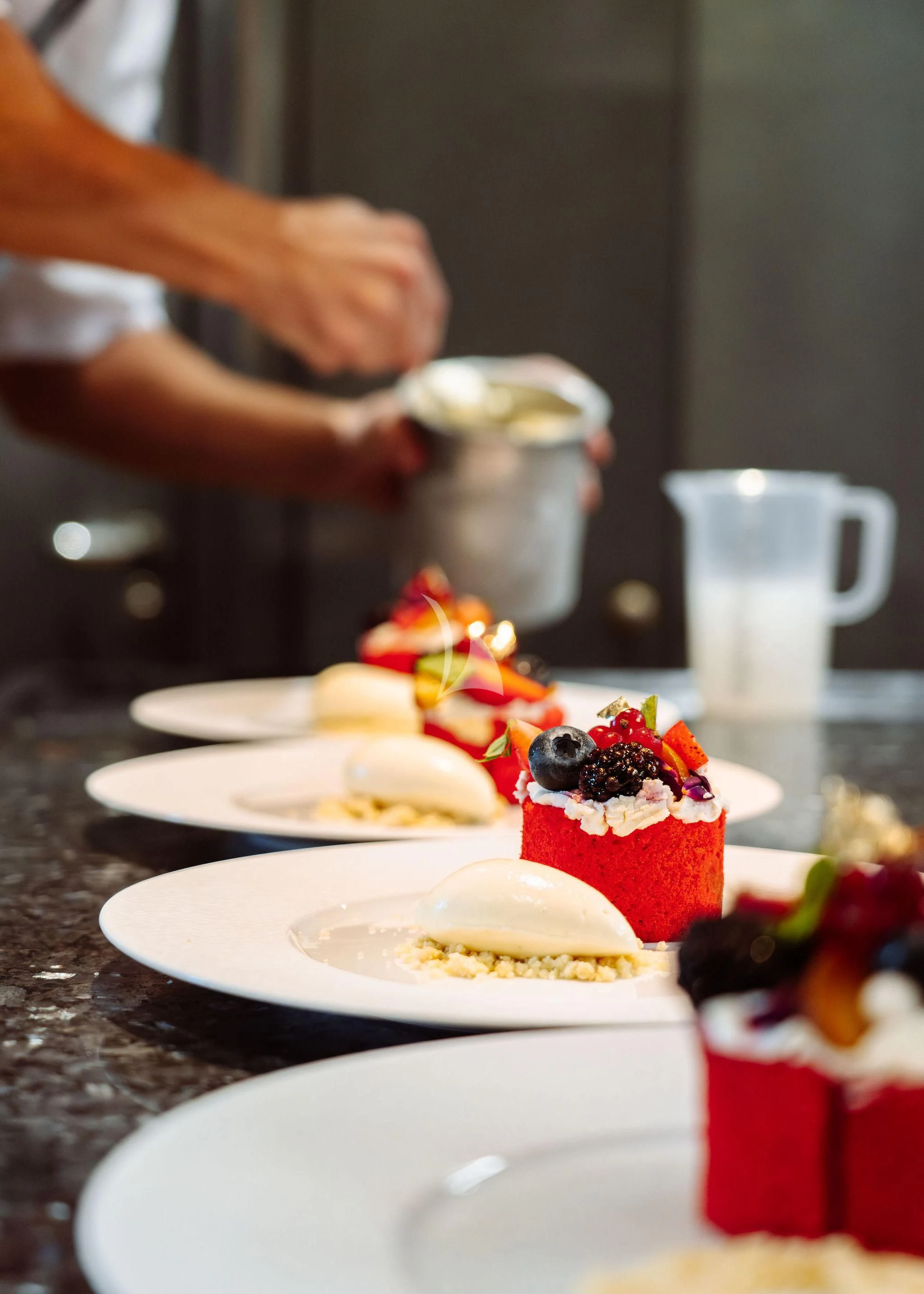 a table with plates of desserts aboard SAMIRA Yacht for Sale