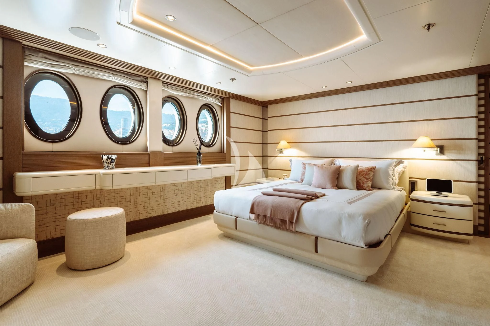 a large bedroom with a large mirror aboard SAMIRA Yacht for Sale