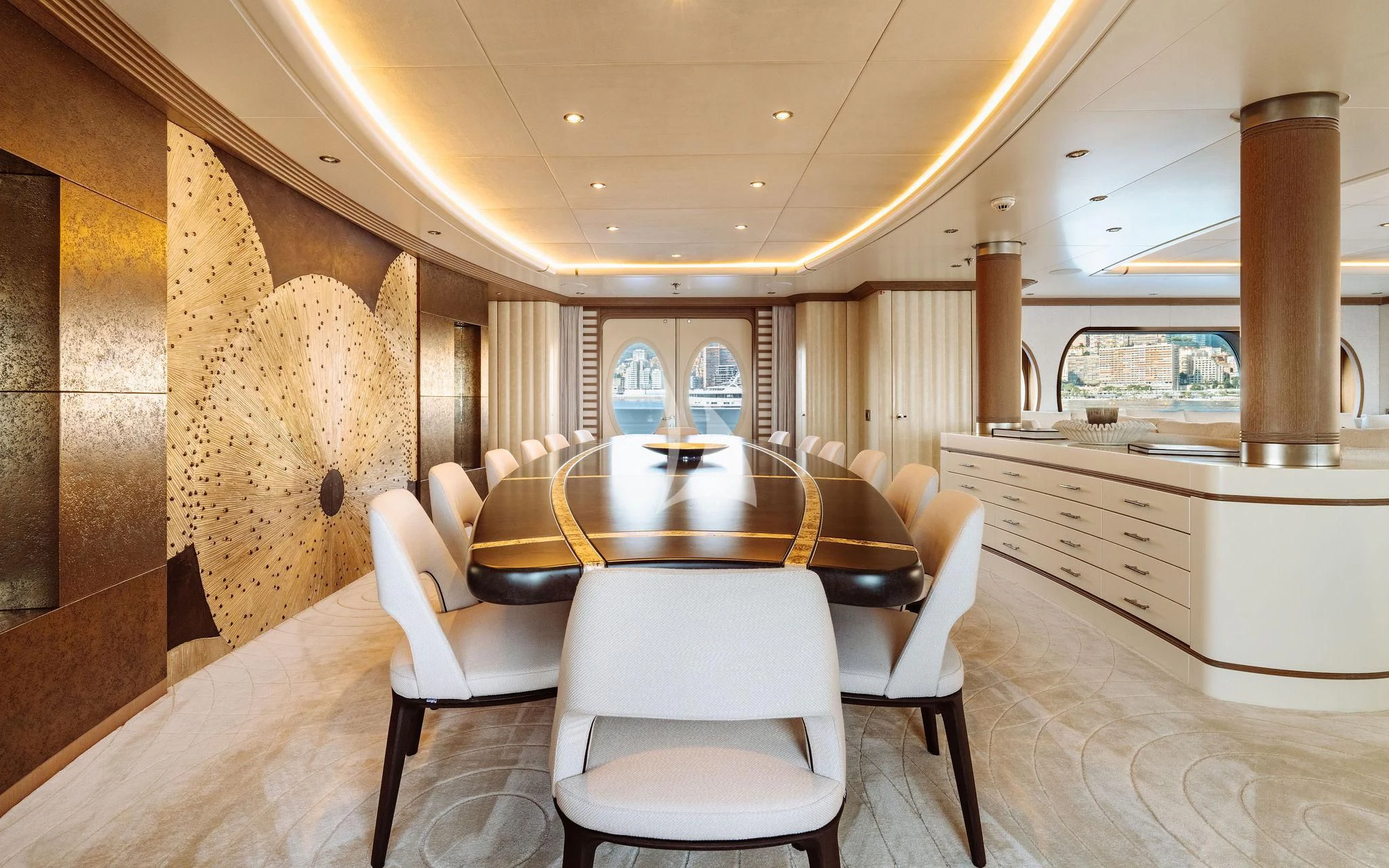 a large room with a table and chairs aboard SAMIRA Yacht for Sale