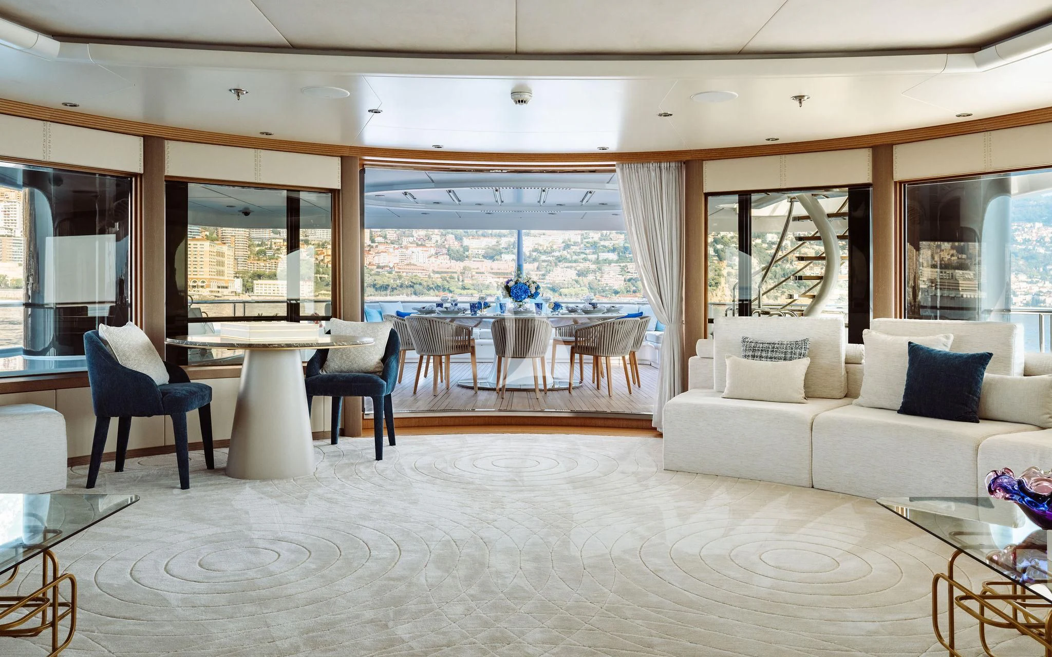 a living room with a large window aboard SAMIRA Yacht for Sale