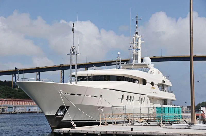 a white boat docked aboard SAMIRA Yacht for Sale