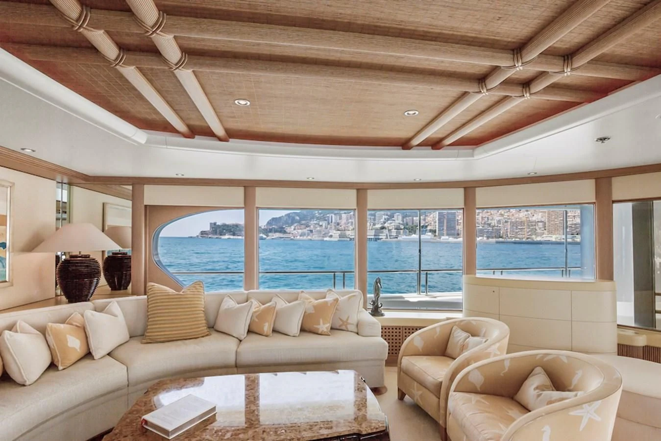 a living room with a large window aboard SAMIRA Yacht for Sale