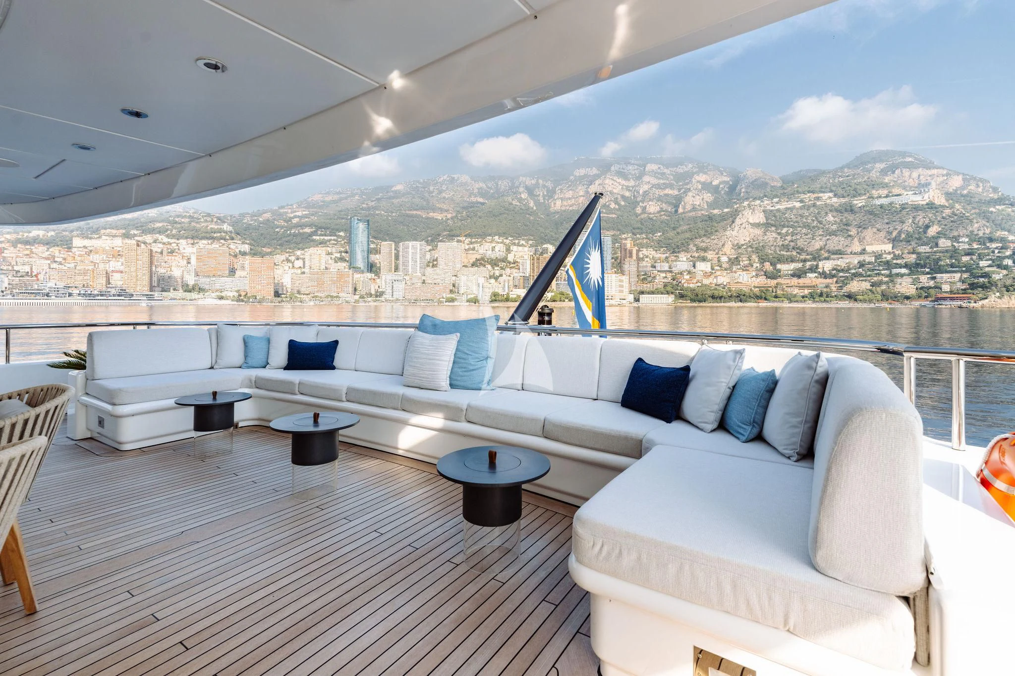 a large white couch with a view of a city aboard SAMIRA Yacht for Sale