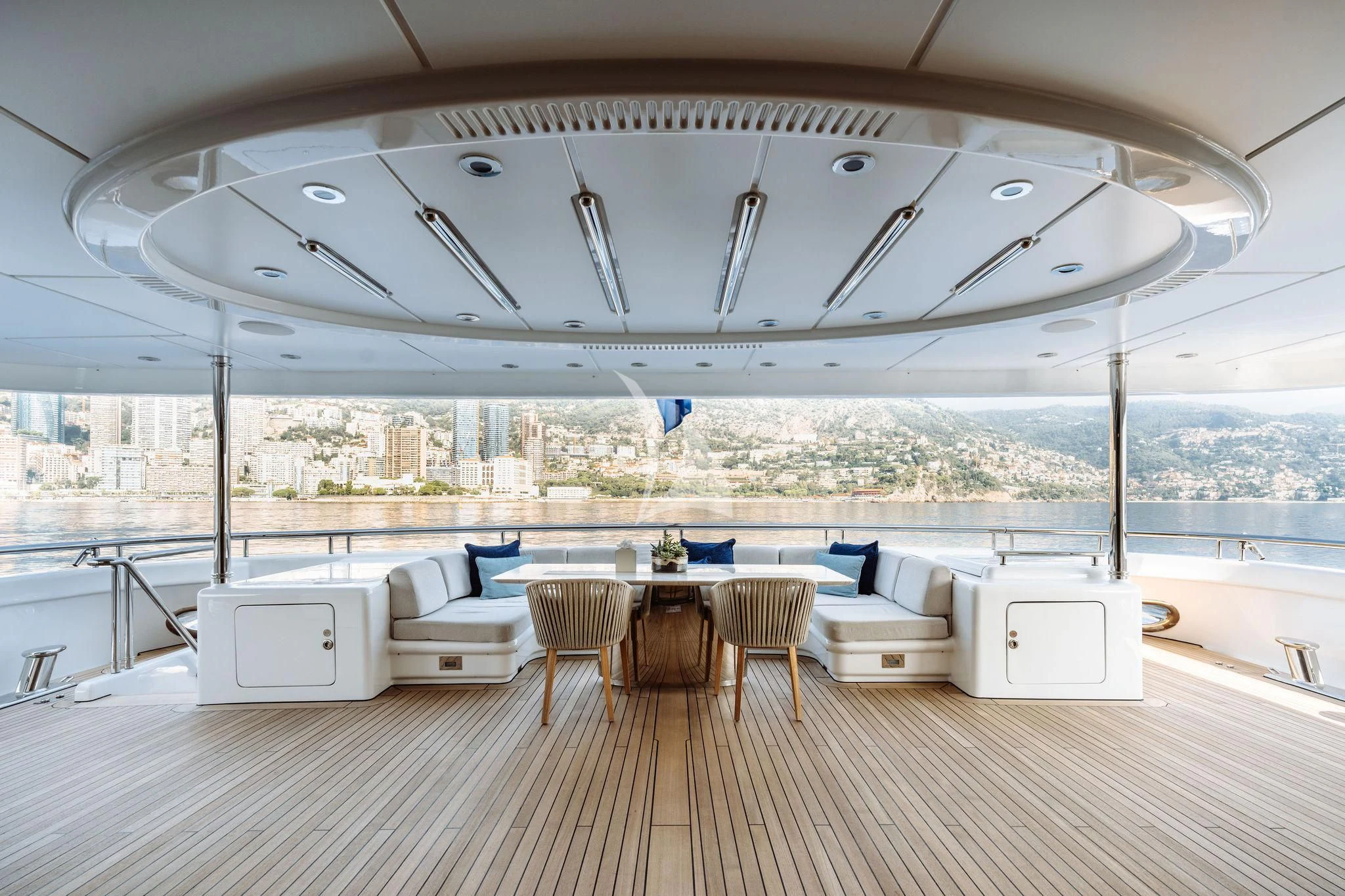 a large room with a table and chairs aboard SAMIRA Yacht for Sale